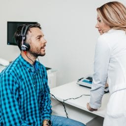Middle-aged man getting a hearing test.