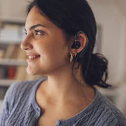 Young woman smiling wearing hearing aids